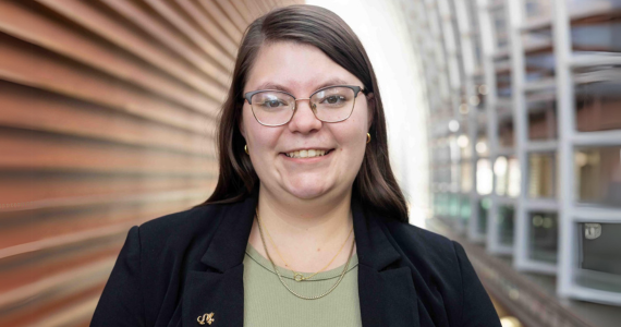 Kaylee smiling for a professional headshot